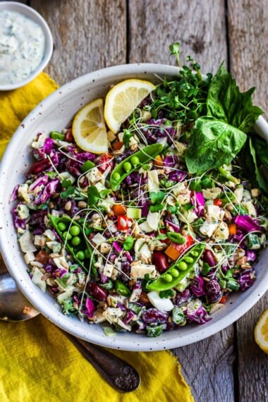 A deliciously crunchy and rainbow-colored Chopped Salad with cabbage, bell pepper, and kidney beans tossed in a yogurt dressing. &nbsp;Perfect for lunch and dinner- this healthy salad keeps for 4 days in the fridge. Vegan-adaptable.