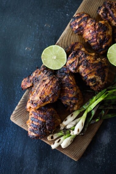 Smoky, spicy and delicious, this Grilled Chipotle Chicken is bathed in the most flavorful marinade. Grill the chipotle chicken ahead and reheat on busy weeknights, or store it in the flavorful chipotle marinade, then fire up the grill after work. Use in burrito bowls, salads, tacos, or pasta. So EASY and oh so tasty! #chipotlechicken #grilledchicken #chicken #chipotle #grilled
