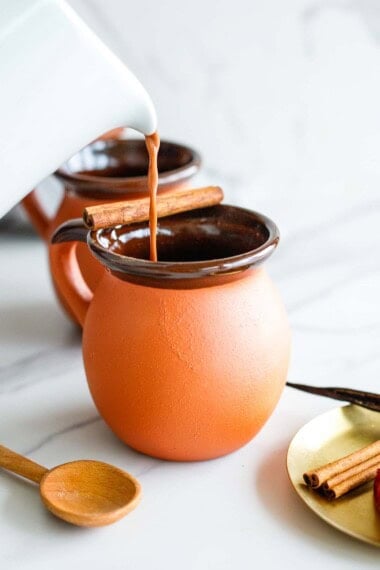 Warm up with a mug of spiced Mexican Hot Chocolate—infused with cinnamon, cardamom, cloves, and vanilla. Made with cacao powder, your choice of milk, and sweetened with honey (or maple syrup), this cozy drink comes together in just 10 minutes! Vegan-adaptable.