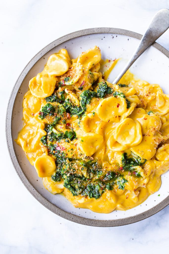 orecchiette pasta with carrot miso sauce topped with carrot top gremolata. 