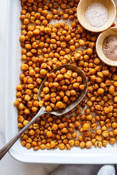 Need a delicious healthy protein snack? Crispy Roasted Chickpeas to the rescue. Easy to make, fun to eat, and good for you! Vegan and Gluten-free.