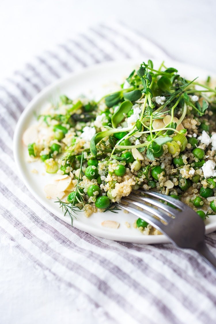 A simple recipe for Quinoa Asparagus Salad ( aka Spring Tabouli) tossed with English peas, fresh dill, parsley, toasted almonds in a lemony dressing topped with optional avocado, goat or feta cheese. A healthy, flavorful salad that can be made ahead- perfect for special gatherings or midweek lunches! GF & Vegan adaptable!