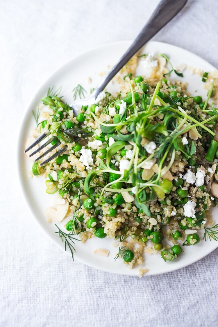 A simple recipe for Quinoa Asparagus Salad ( aka Spring Tabouli) tossed with English peas, fresh dill, parsley, toasted almonds in a lemony dressing topped with optional avocado, goat or feta cheese. A healthy, flavorful salad that can be made ahead- perfect for special gatherings or midweek lunches! GF & Vegan adaptable!