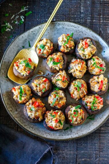 These stuffed mushrooms are elegant, crowd-pleasing, and easy to make-a catering favorite made with pine nuts, fresh herbs, lemon zest, and cream cheese. Gluten-free and vegan-adaptable!